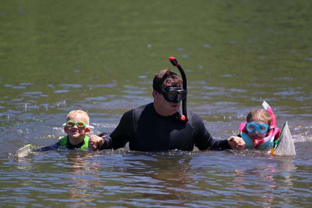 Dan Spooner, center, escorts his son, Emmet, and daughter, Elliot, as they explore the West Branch of the Delaware River. DC