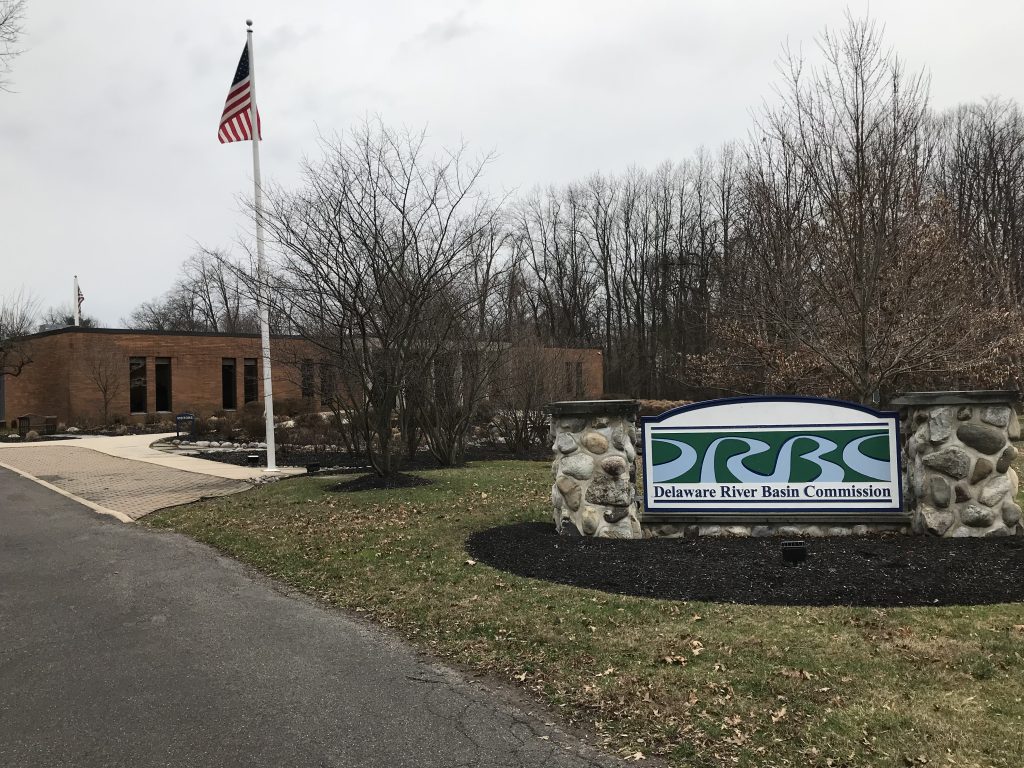 A sign for the Delaware River Basin Commission outside of its brick building headquarters.