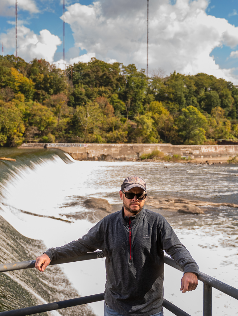 Ken Conly, of the Philadelphia Canoe Club, stands at the top of the Manayunk Canal. He has mixed feelings about the lack of access for its planned renovation. Photo by Chris Baker Evens.