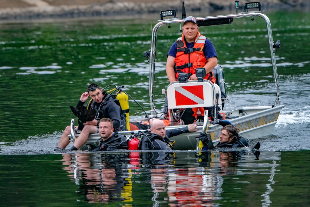 The Westfall Volunteer Fire Department dive team searches for Jeysson Ariel Osorio-Reyes on the afternoon of June 29. PHOTO BY PRESTON EHRLER 