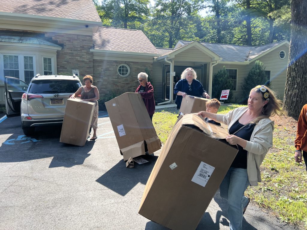 Group of women with large boxes