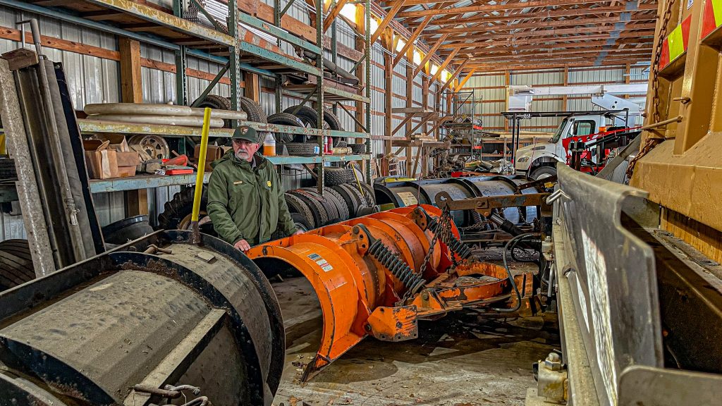 BIll Tagye, the Delaware Water Gap National Recreation Area's chief of maintenance, overlooking the plow equipment at the Dingmans Maintenance Facility. Photo by Preston Ehrler