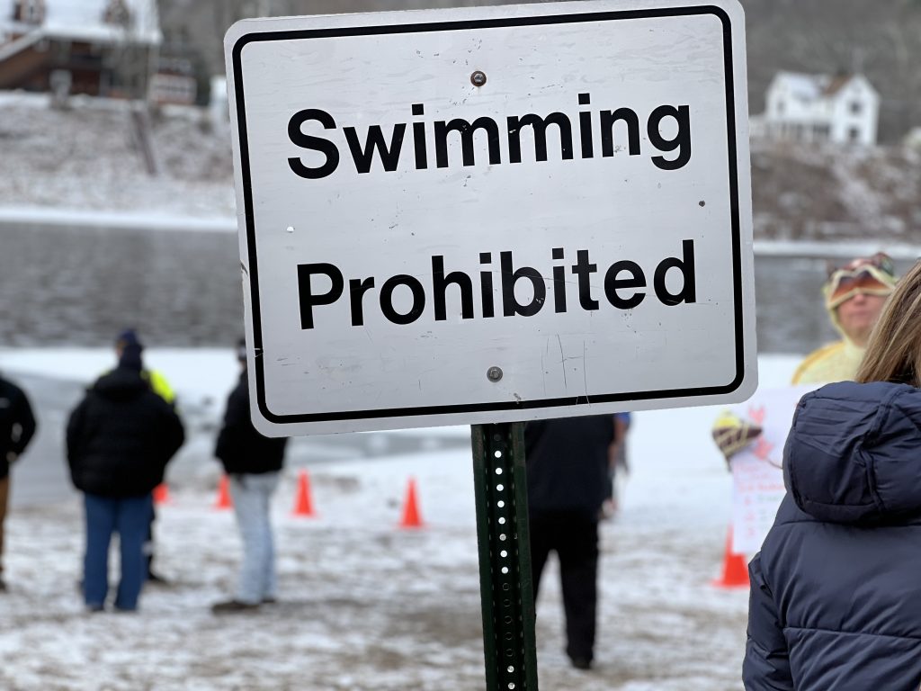 Sign that says swimnming prohibited