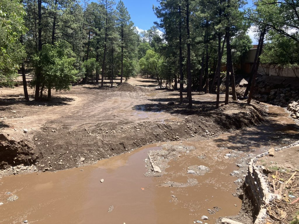 IMG_4351 The Rio Ruidoso runs through Ruidoso, New Mexico on Saturday, July 19. Debris has been cleared from some areas along the river after deadly flash floods on July 8. Credit: Martha Pskowski/Inside Climate News