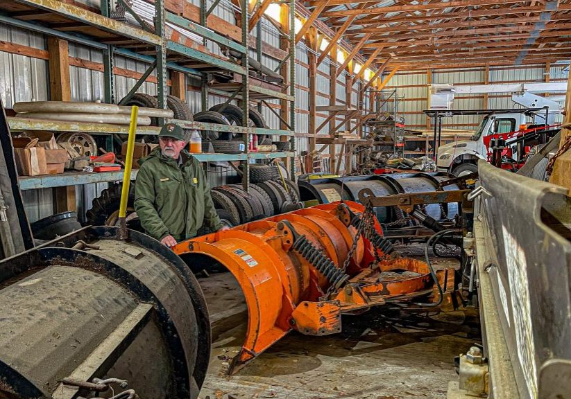 BIll Tagye, the Delaware Water Gap National Recreation Area's chief of maintenance, overlooking the plow equipment at the Dingmans Maintenance Facility. Photo by Preston Ehrler