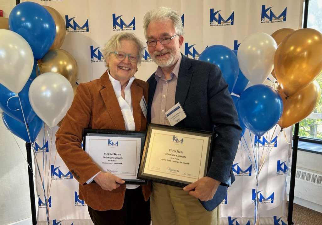 Meg McGuire, founder, publisher and editor of Delaware Currents, and her husband, Chris Mele, celebrating two of the five awards bestowed on the news site by the Pennsylvania News Media Association.
