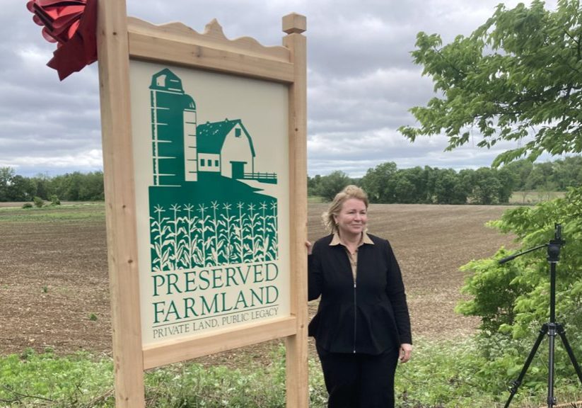 Susan Payne, retiring executive director of the State Agriculture Development Committee, New Jersey’s farmland preservation agency, at the 566 acres of Warren County farmland that was slated for warehouse development but has been purchased by the state, and will remain agricultural land in perpetuity. PHOTO BY JON HURDLE