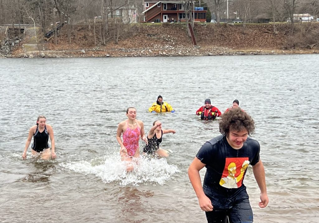 Kids take the plunge into the Delaware River.